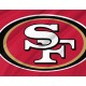 San Francisco 49ers flag with iconic logo, flying outdoors.